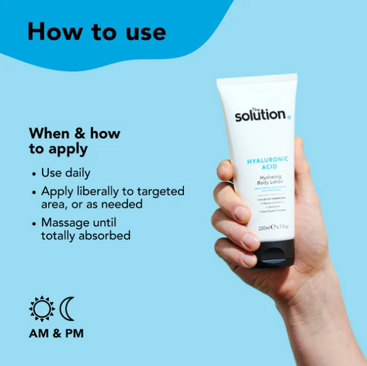 Hand holding a tube of 'solution' hyaluronic acid body lotion with usage instructions on a blue background.