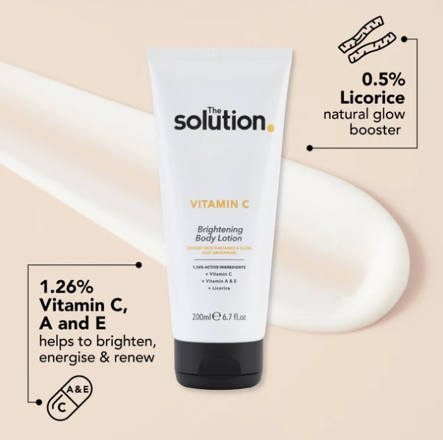 Tube of 'The Solution' Vitamin C Brightening Body Lotion on a beige background