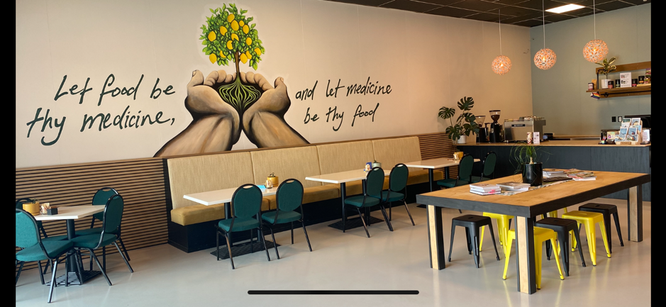 an image of the plantbased cafe seating and service counter