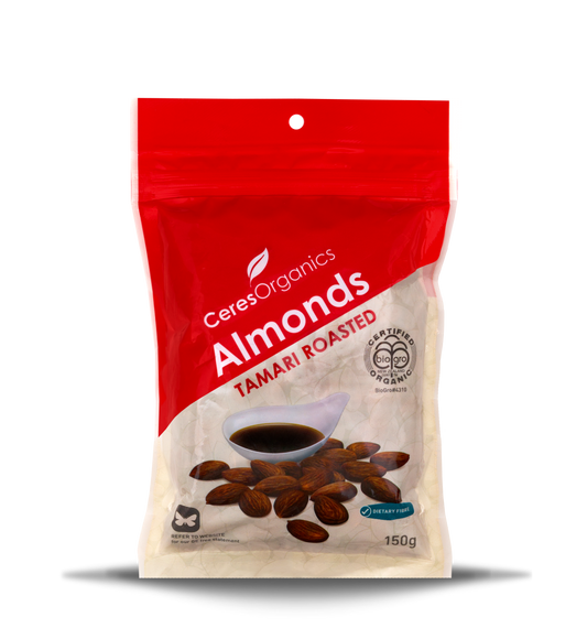 A package of Ceres Organics Almonds Tamari Roasted 150g. The packaging is predominantly red with an image of roasted almonds in the center.