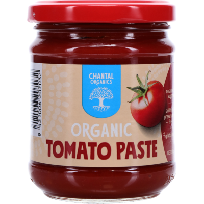 A jar of Chantal Organic Tomato Paste with a red lid and a label showing a ripe tomato. The jar is glass and the product is 200gm.