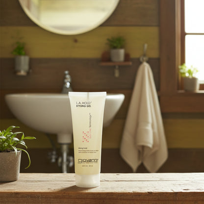 A tube of Giovanni L.A. Natural Styling Gel, with white and pink design elements, 200ml size.