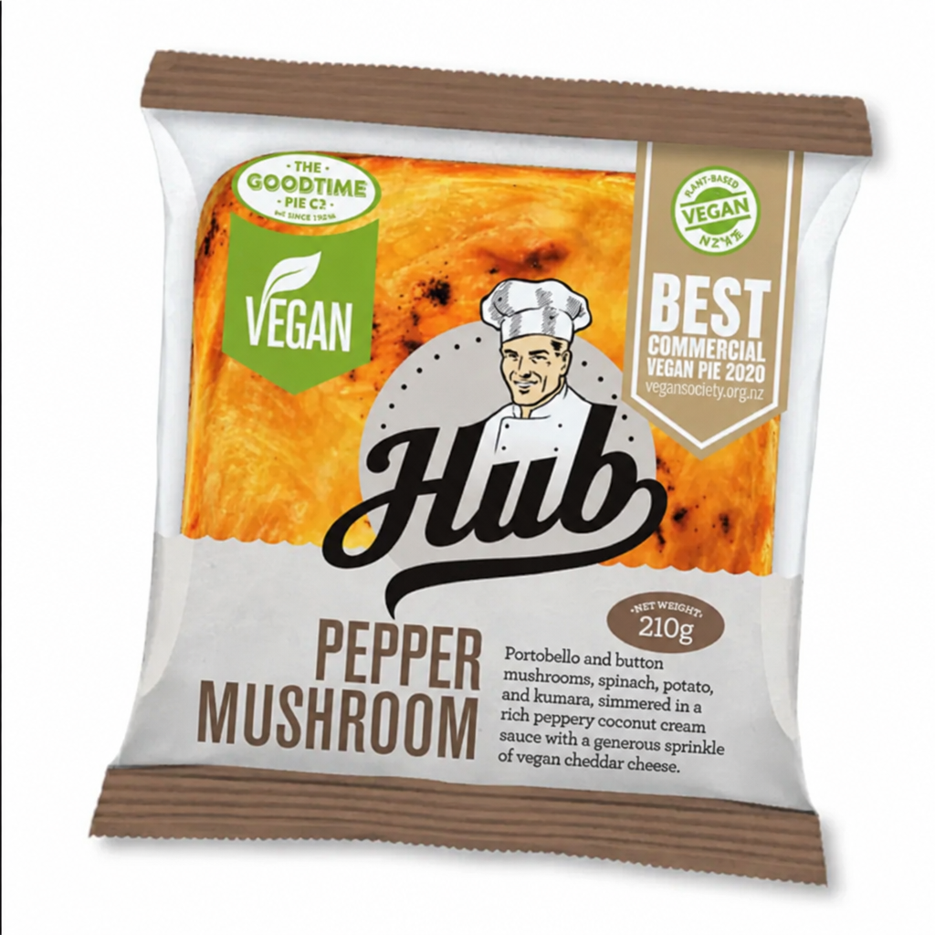 A packaged vegan pie from Hub, specifically Pepper Mushroom flavor, in a white and brown paper bag with a printed chef illustration and product details.
