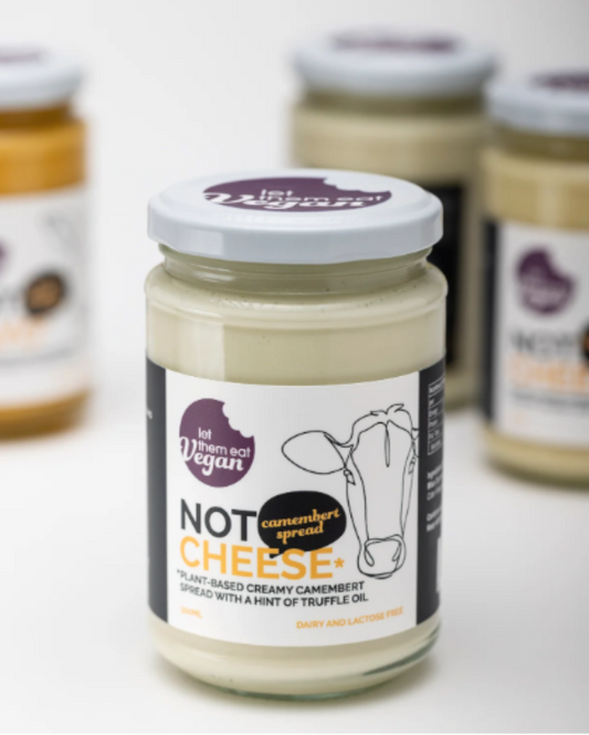 Jar of Let Them Eat Vegan Camembert Spread  with a cow illustration on a white background