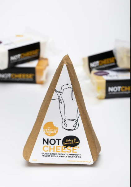 Let Them Eat Vegan Camembert Wedge with branding on a white background