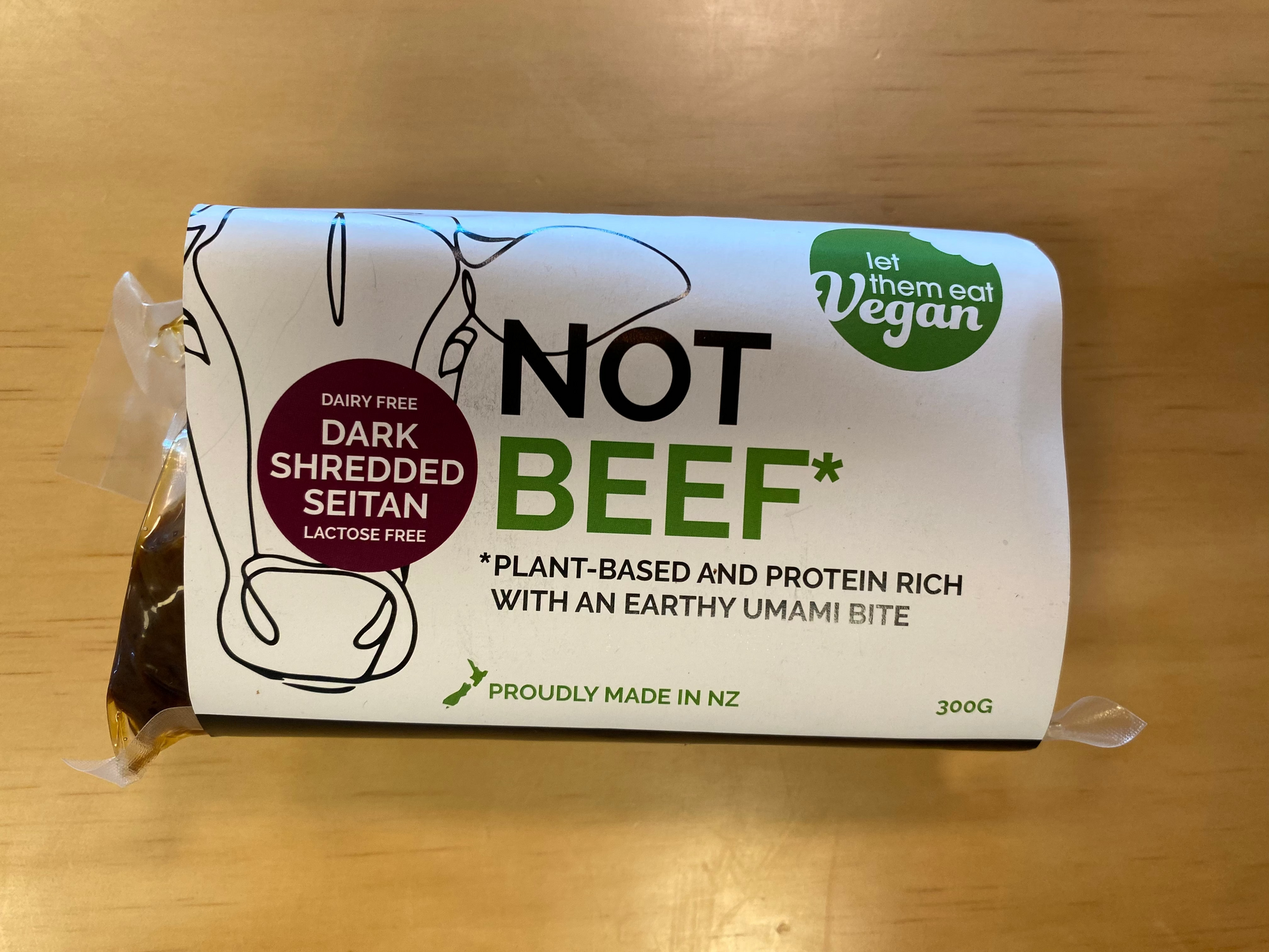 Packaged Let Them Eat Vegan 'Not Beef' on a wooden surface