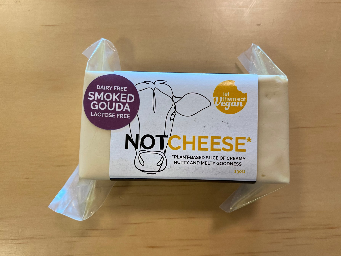 Let Them Eat Vegan Smoked Gouda Block on a wooden background