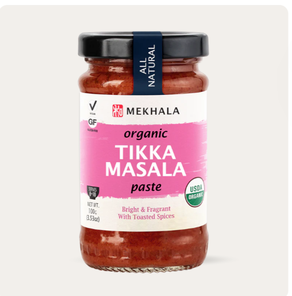 Jar of Mekhala organic Tikka Masala paste on a white background