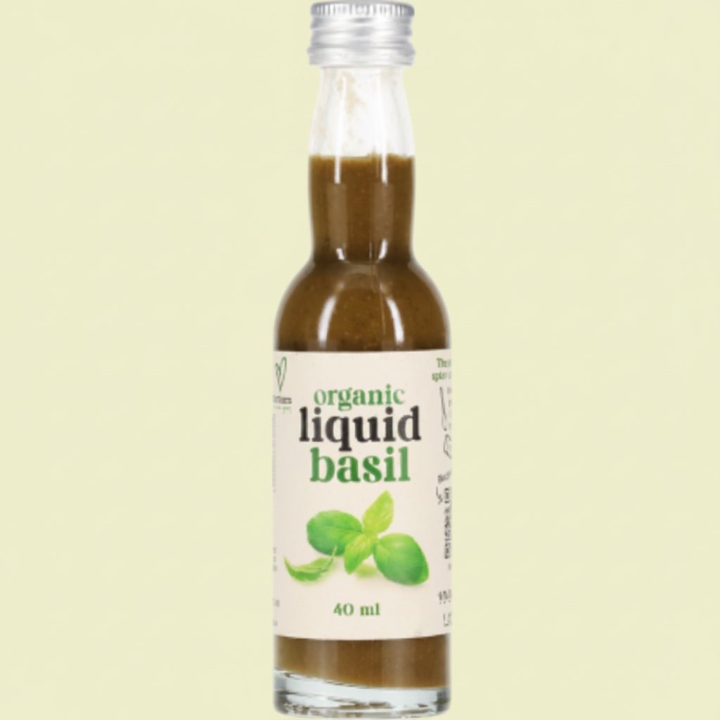 Bottle of organic liquid basil on a white background