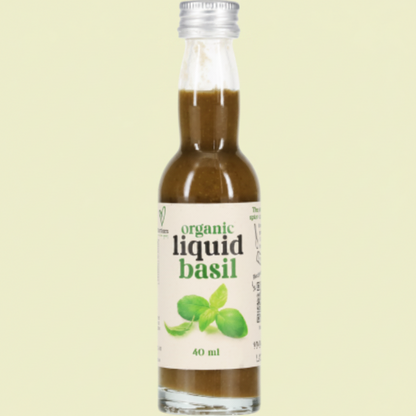 Bottle of organic liquid basil on a white background