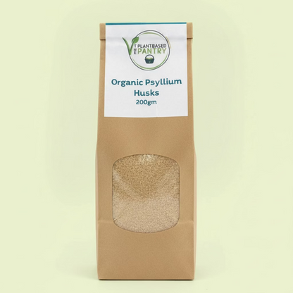 The Plantbased Pantry branded paper bag of organic psyllium husks with 'Plant-Based Pantry' label on a neutral background