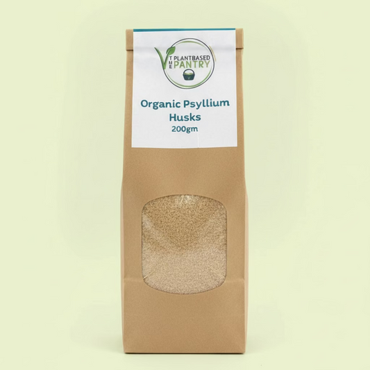 The Plantbased Pantry branded paper bag of organic psyllium husks with 'Plant-Based Pantry' label on a neutral background