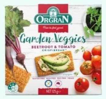 Orgran Garden Veggies Beetroot & Tomato Crispbread packaging with vegetables on a white background