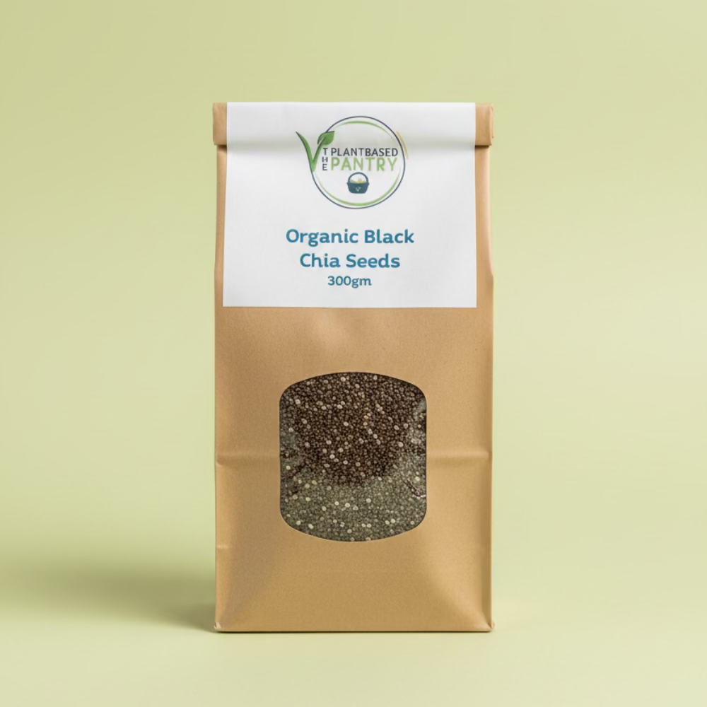 Bag of PBPantry organic black chia seeds with a visible brand label on a wooden surface