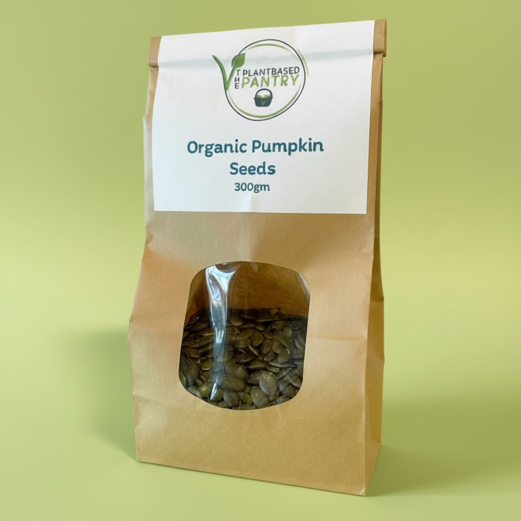 Bag of The Plantbased Pantry organic pumpkin seeds with a visible brand label on a neutral background