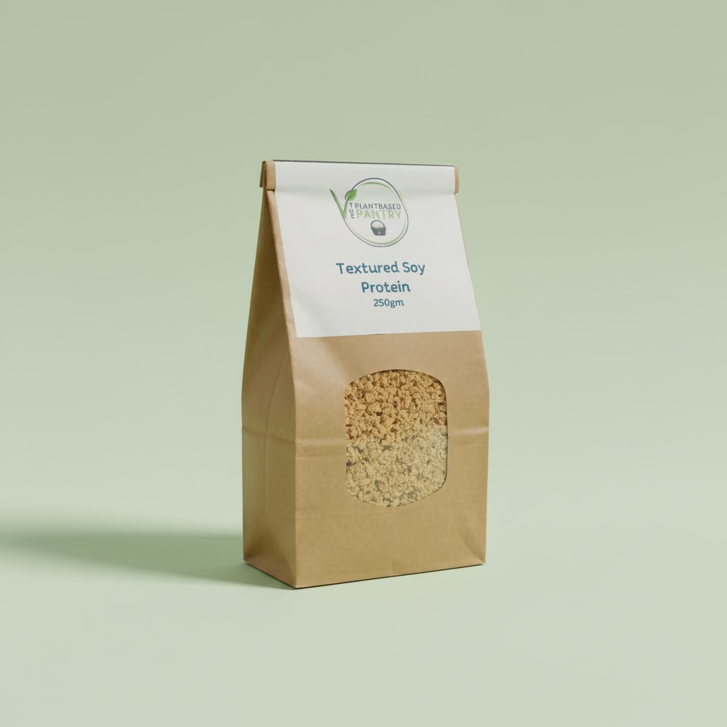 A 250g bag of PlantBased Pantry Textured Soy Protein in a brown paper bag with a white label, sitting on a wooden table.