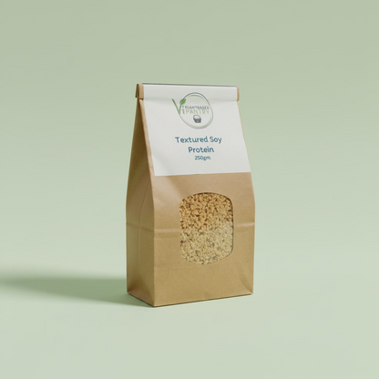 A 250g bag of PlantBased Pantry Textured Soy Protein in a brown paper bag with a white label, sitting on a wooden table.