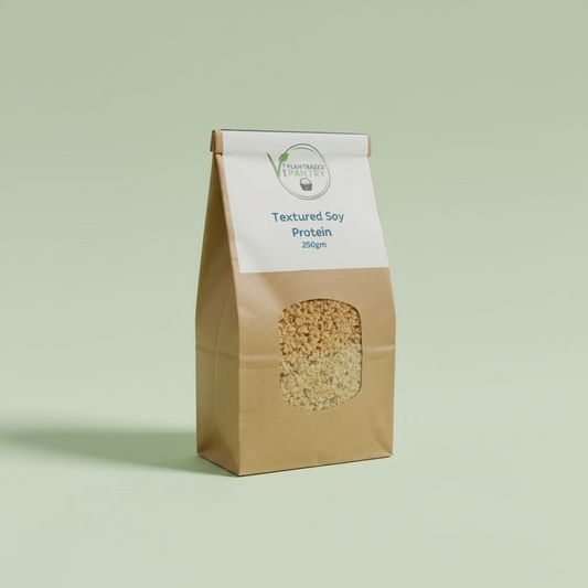 A 250g bag of PlantBased Pantry Textured Soy Protein in a brown paper bag with a white label, sitting on a wooden table.