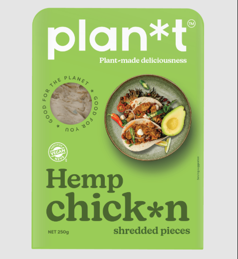 Green package of 'plan*t' Hemp Chicken shredded pieces with a plate of food and avocado on a gray background.