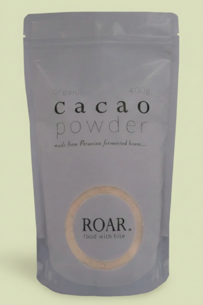 Package of cacao powder by ROAR on a white background
