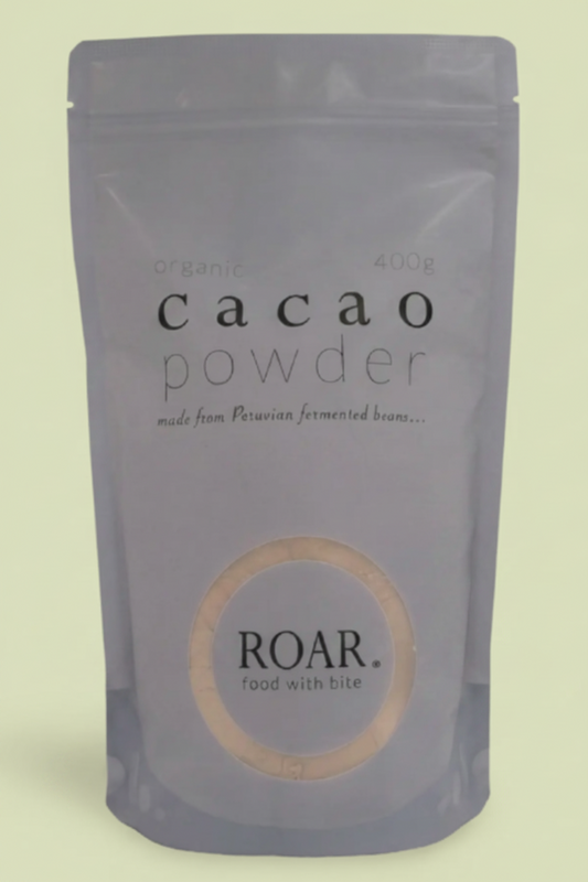 Package of cacao powder by ROAR on a white background
