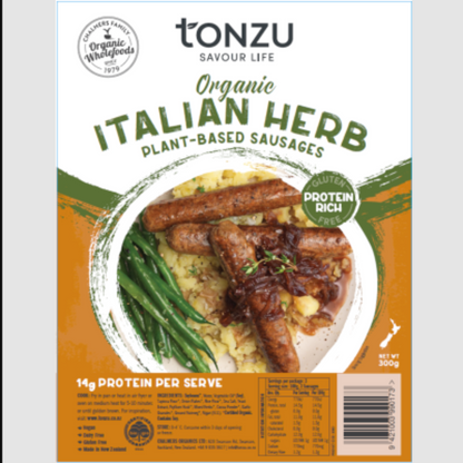 Front packaging of Tonzu Savour Life Organic Italian Herb Plant-Based Sausages, featuring a food label with a plated sausage dish, green beans, and orange and white background design.
