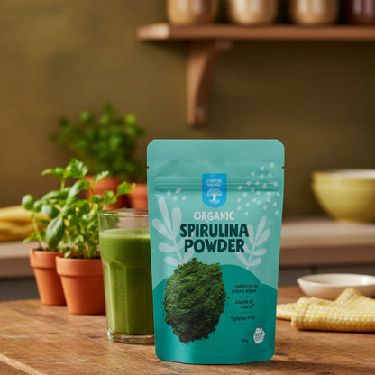 Teal package of organic spirulina powder with text and a picture of green powder.