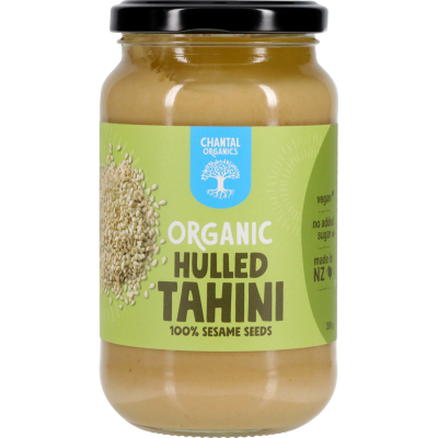 A jar of Chantal Organic Hulled Tahini with the label showing the brand name, product name, and an image of sesame seeds.