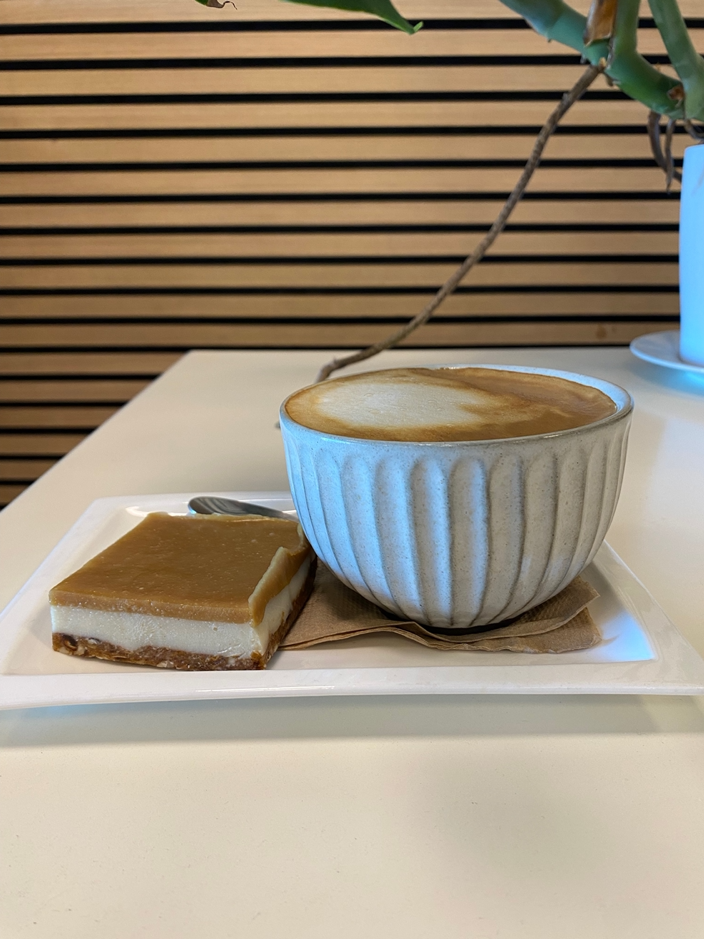 PBCafe oat milk flat white served with vegan gluten free salted caramel slice