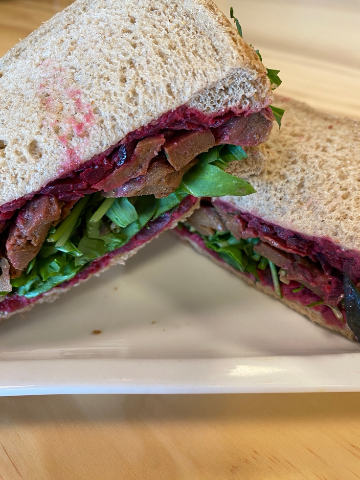 NOT Beef from let them eat vegan and horseradish beetroot slaw salad sandwich on harvest rye bread