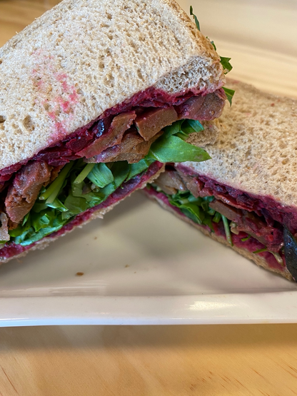 NOT Beef from let them eat vegan and horseradish beetroot slaw salad sandwich on harvest rye bread